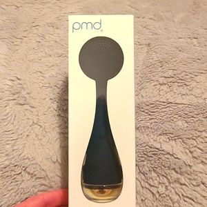 PMD Smart facial cleansing device in navy blue